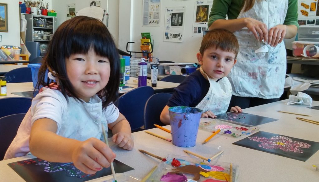 Children painting during art class in Roanoke